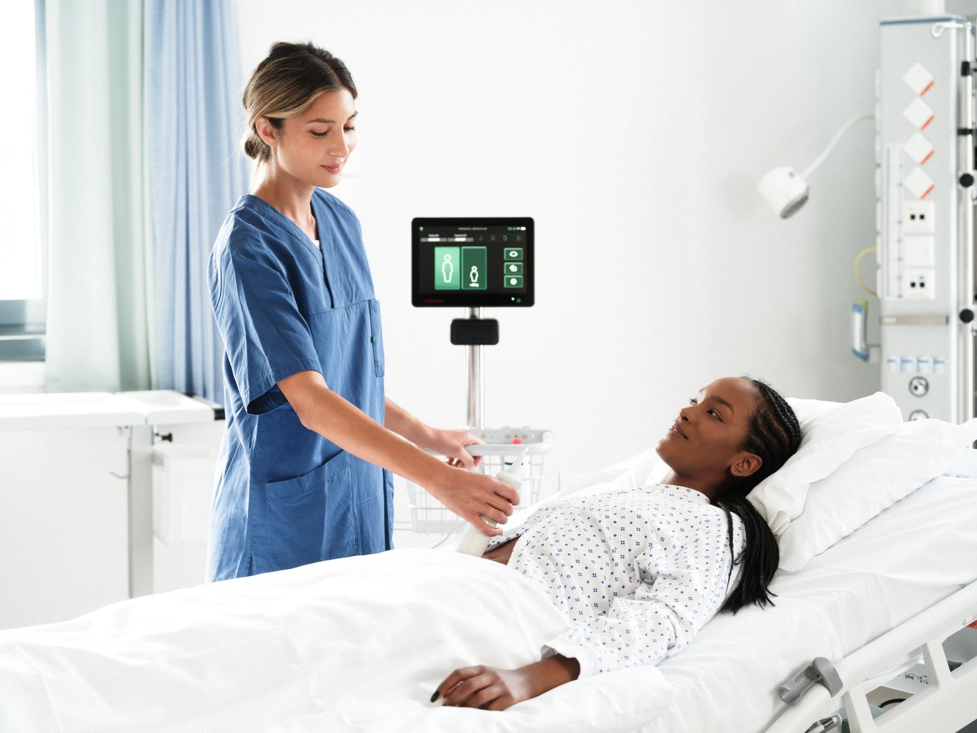 Healthcare professional using Vitascan bladder scanner